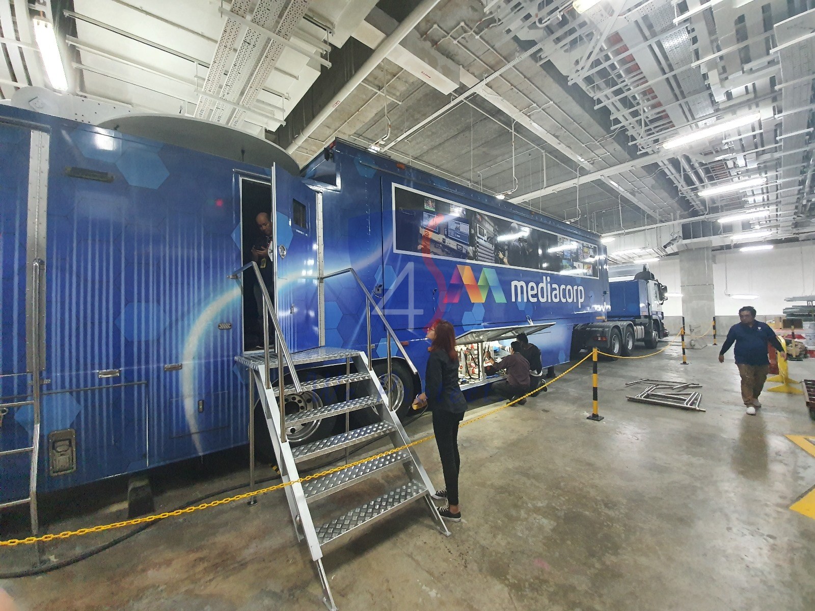 Four Solutions team working at a MediaCorp production facility
